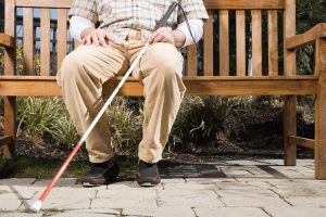 Blind man sitting on a bench